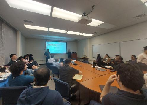 Students listening to graduate defense
