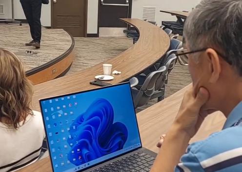 David speaking while Ron listens on laptop